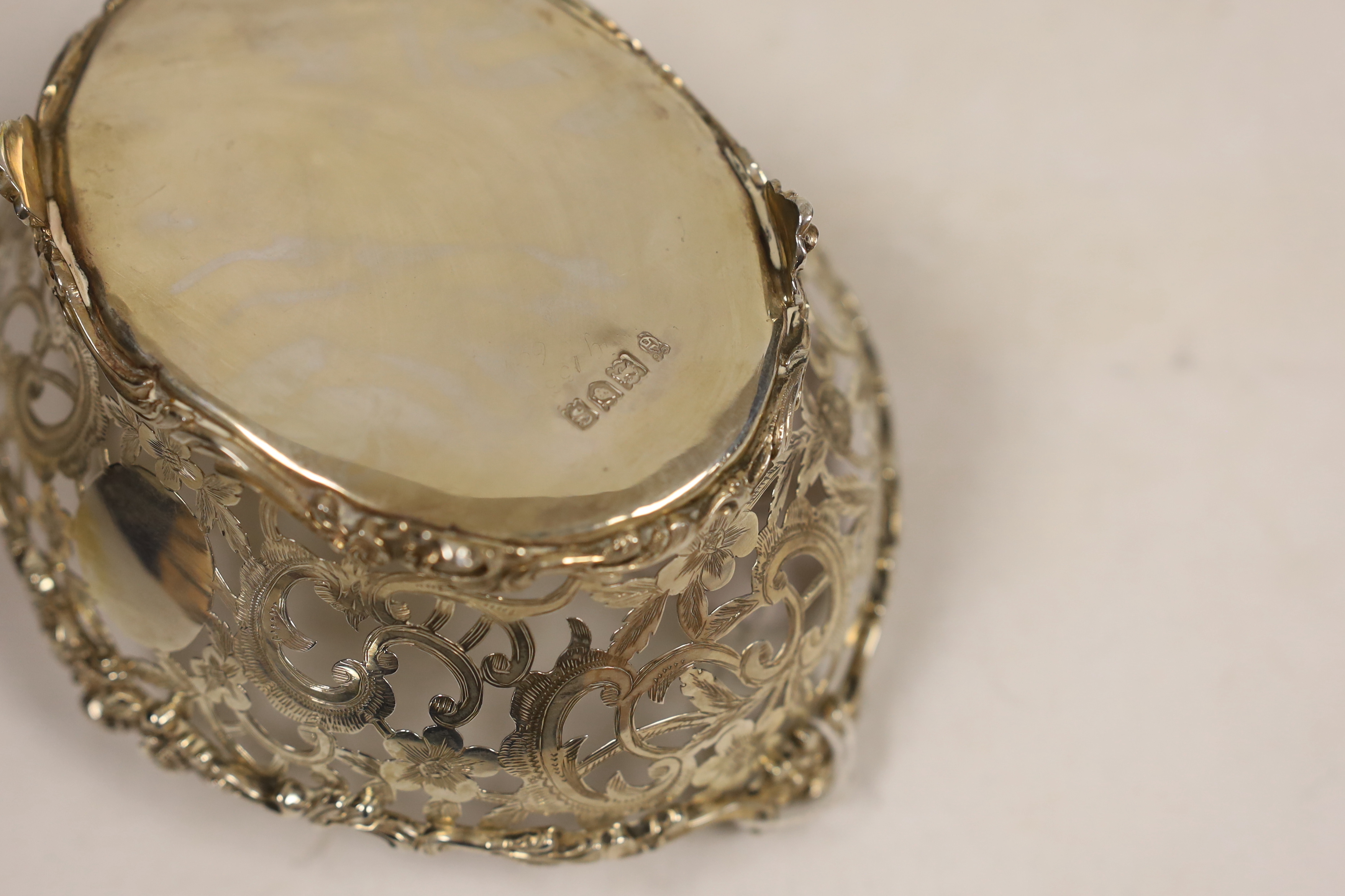 A George V pierced silver sweetmeat bowl, Charles Stuart Harris & Sons, London, 1913, length 15.3cm, 6.2oz.